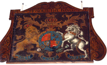 The royal arms hanging on the east face of the west tower March 2011